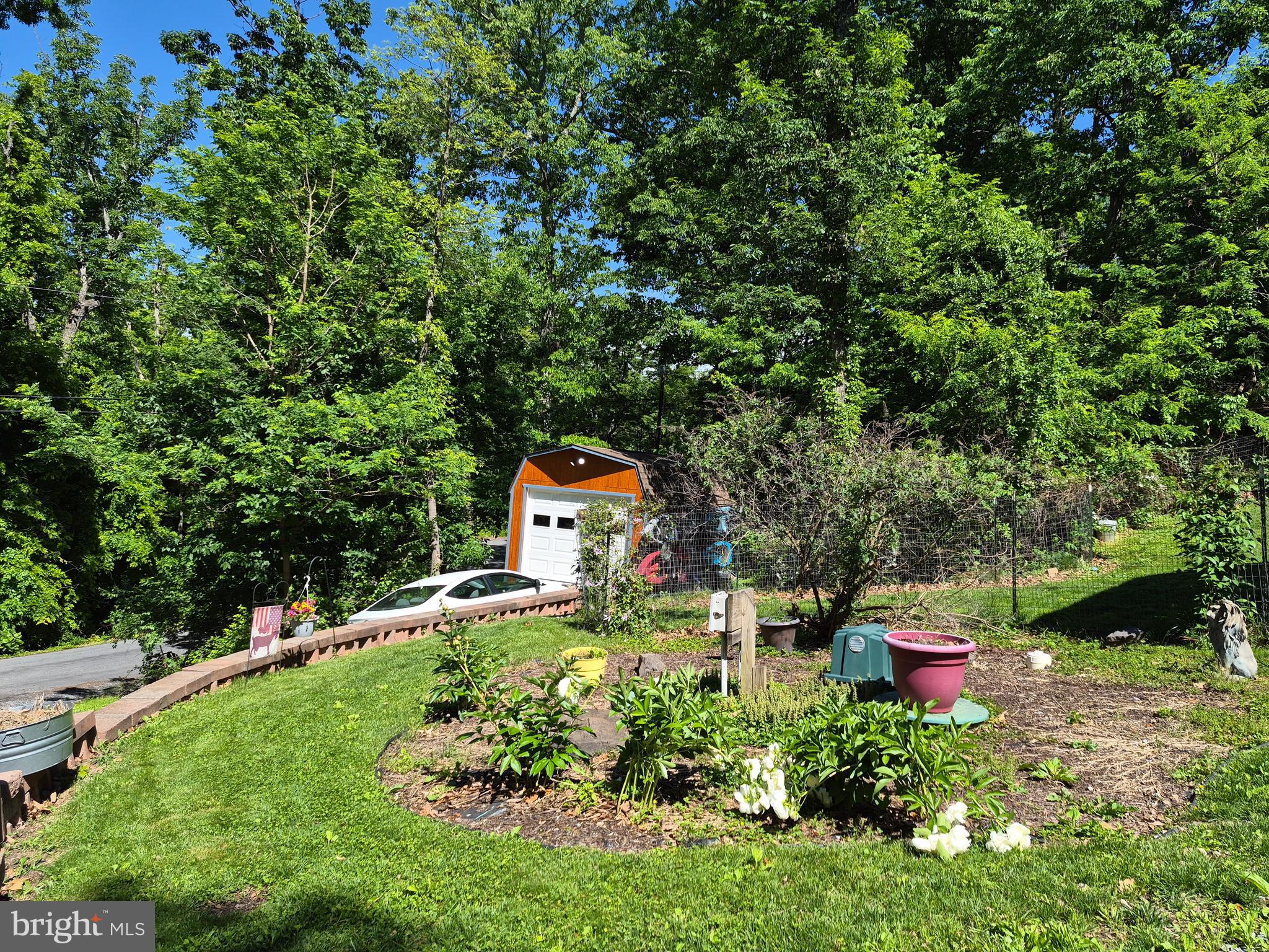1440 Drummer Hill Road Front Royal, VA 22630 - Photo 17 of 42 a backyard of a house with a yard and outdoor seating