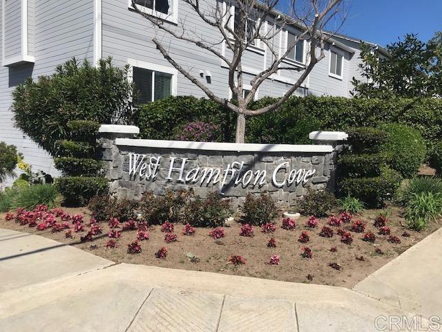 a view of a sign board with wooden fence