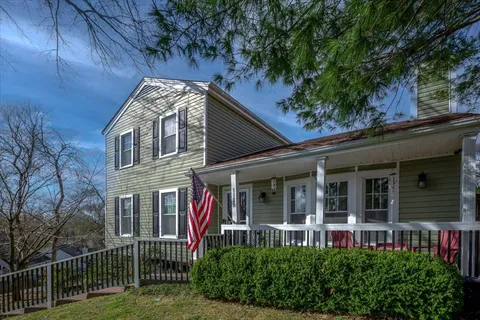 front view of a house with a garden