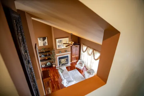 a bedroom with bed couch and window