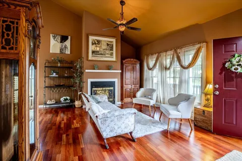 a living room with furniture and a fireplace