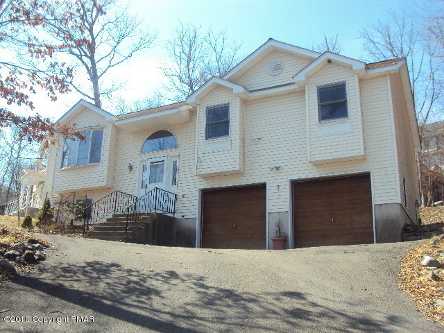 28 Cherry Ridge Road Layton, NJ 07851 - Photo 1 of 11 a front view of a house with a yard