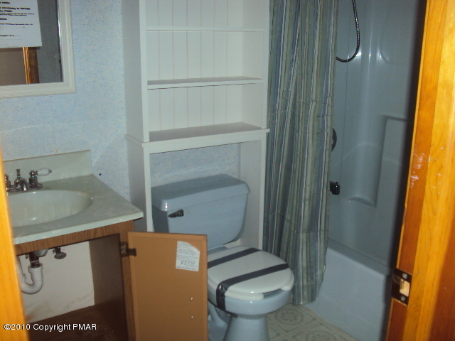 28 Cherry Ridge Road Layton, NJ 07851 - Photo 3 of 11 a bathroom with a toilet and a sink