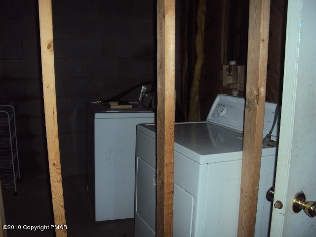 28 Cherry Ridge Road Layton, NJ 07851 - Photo 9 of 11 a kitchen with a sink and a refrigerator