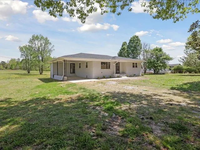 a view of a house with a big yard