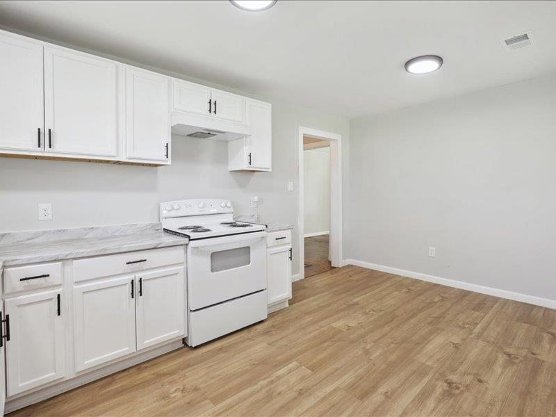 2725 Porter Road Mason, TN 38049 - Photo 11 of 33 a kitchen with white cabinets and white appliances