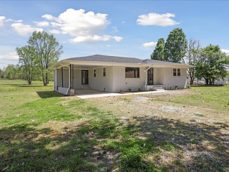 2725 Porter Road Mason, TN 38049 - Photo 2 of 33 a front view of house with yard and green space