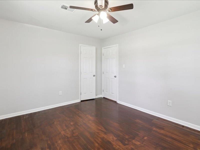 2725 Porter Road Mason, TN 38049 - Photo 23 of 33 a view of an empty room with chandelier fan and wooden floor