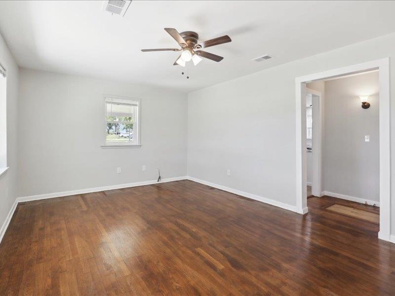 2725 Porter Road Mason, TN 38049 - Photo 6 of 33 an empty room with wooden floor and ceiling fan