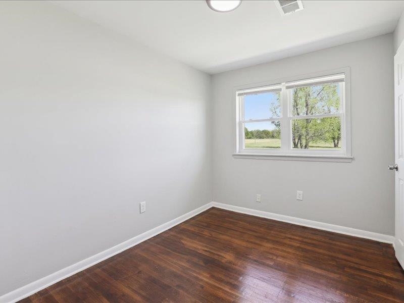 2725 Porter Road Mason, TN 38049 - Photo 9 of 33 wooden floor in an empty room with a window