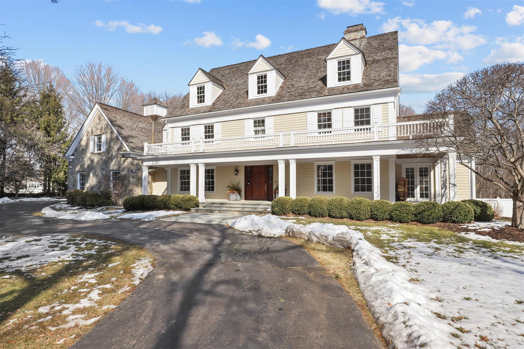 a front view of a building with a yard