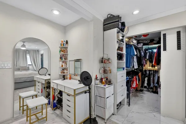 a bathroom with a double vanity sink mirror and shower