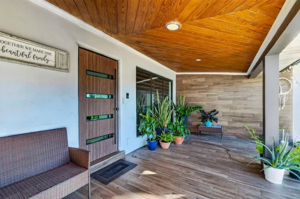 a room with kitchen island a large window in it