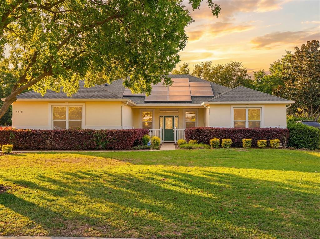 3510 Hunters Trail Circle Eustis, FL 32726 - Photo 1 of 26 a front view of a house with a yard