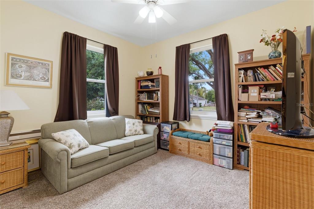 3510 Hunters Trail Circle Eustis, FL 32726 - Photo 18 of 26 a living room with furniture and a book shelf