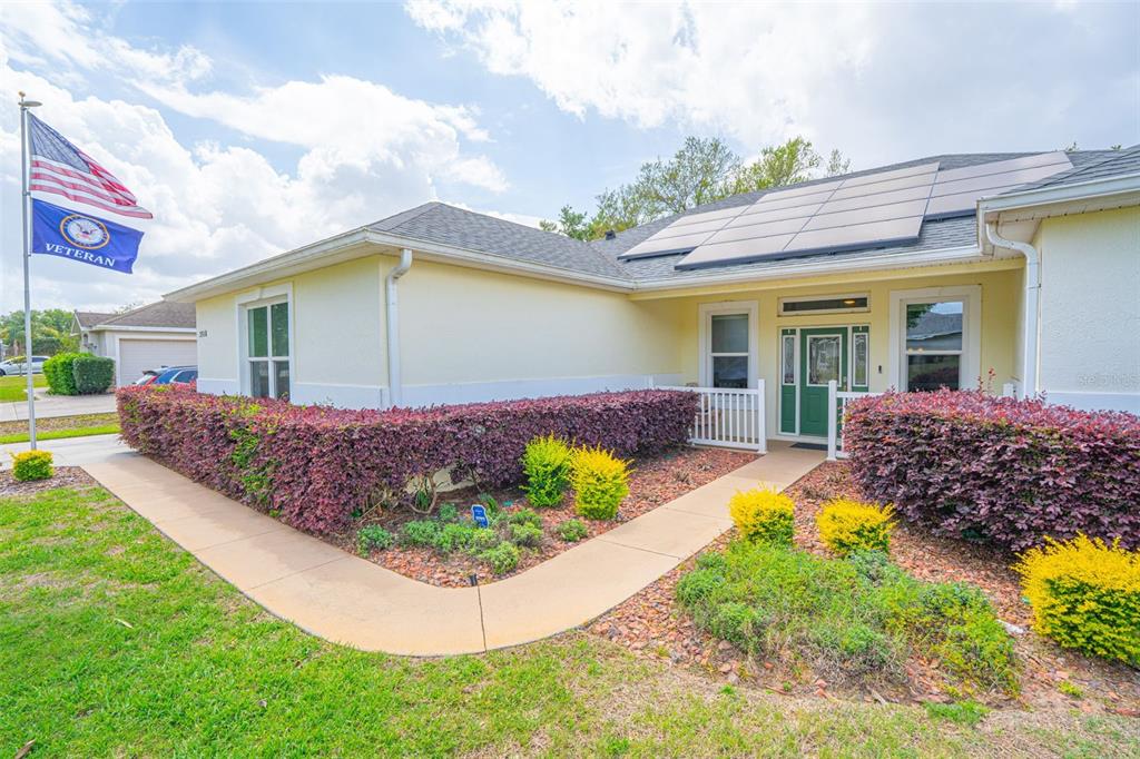 3510 Hunters Trail Circle Eustis, FL 32726 - Photo 5 of 26 a front view of house with yard and trees in the background