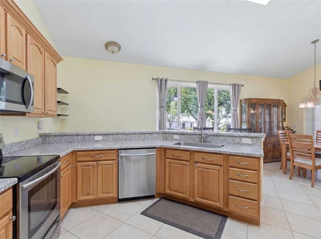 3510 Hunters Trail Circle Eustis, FL 32726 - Photo 7 of 26 a kitchen with a sink stove and cabinets