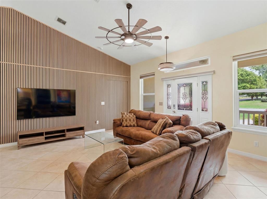 3510 Hunters Trail Circle Eustis, FL 32726 - Photo 10 of 26 a living room with furniture and a flat screen tv