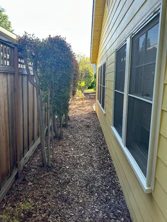 a view of a pathway with a backyard
