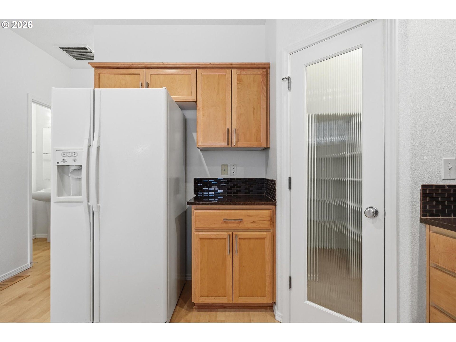 1638 Southwest 173rd Terrace Beaverton, OR 97003 - Photo 13 of 41 a kitchen with a refrigerator and a stove
