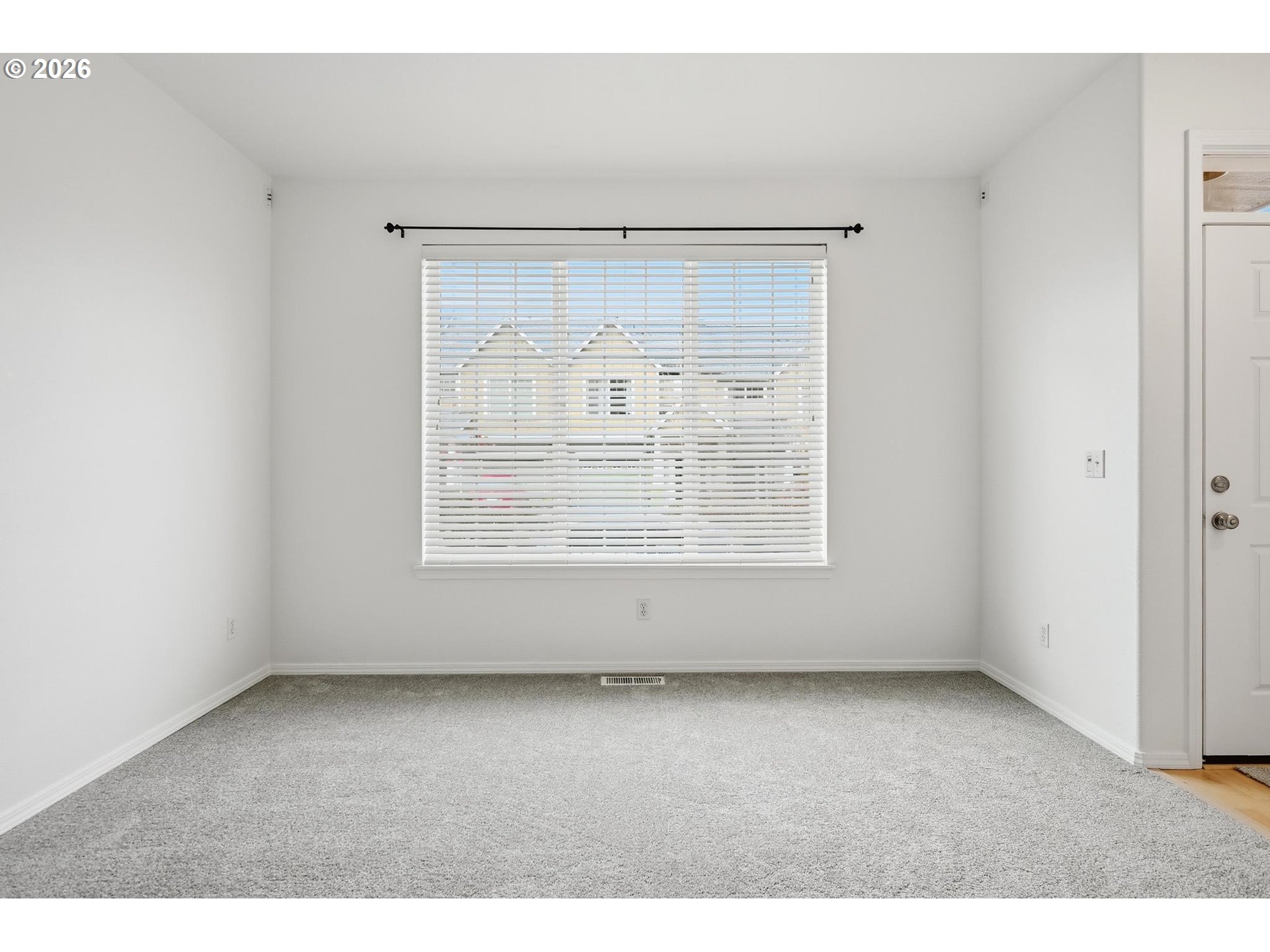 1638 Southwest 173rd Terrace Beaverton, OR 97003 - Photo 5 of 41 an empty room with wooden door and windows