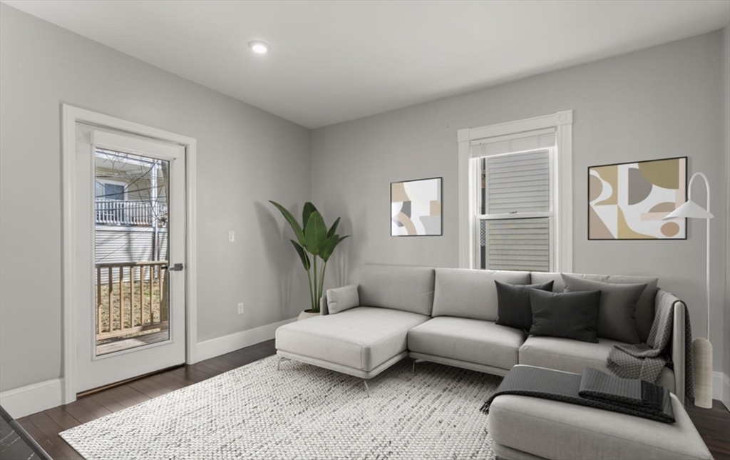 101 Draper Street, Unit 2 Boston, MA 02122 - Photo 5 of 19 a living room with furniture and a window