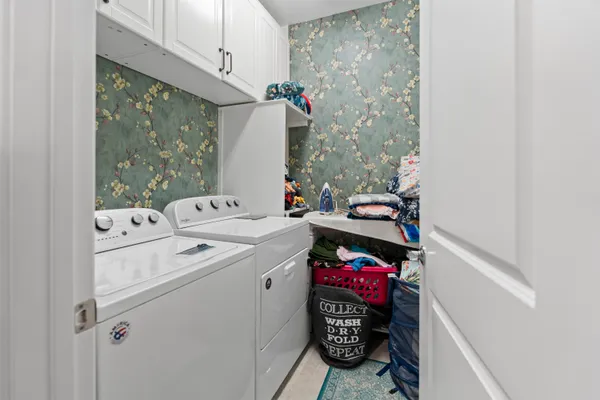 a white tub sitting next to a shower