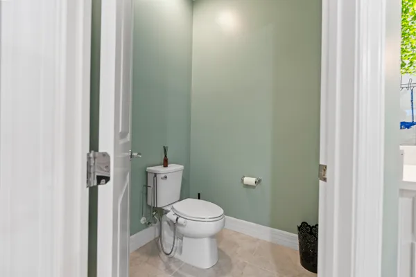a view of a hallway with wooden floor and entryway