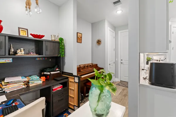 a view of livingroom with hardwood floor and bathroom