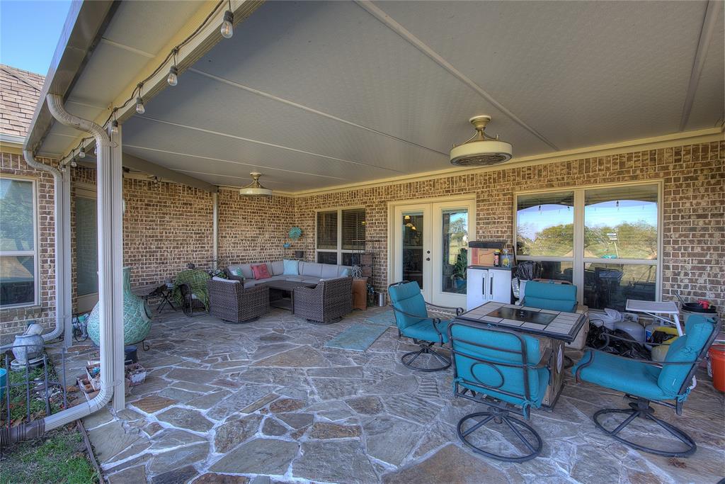 1066 Canyon Lake Road Wills Point, TX 75169 - Photo 27 of 40 a outdoor space with lots of tables a large window and chairs