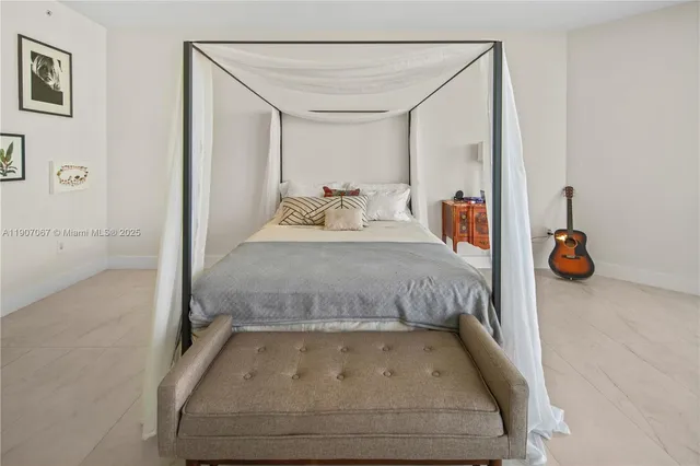 a bathroom with a tub and mirror