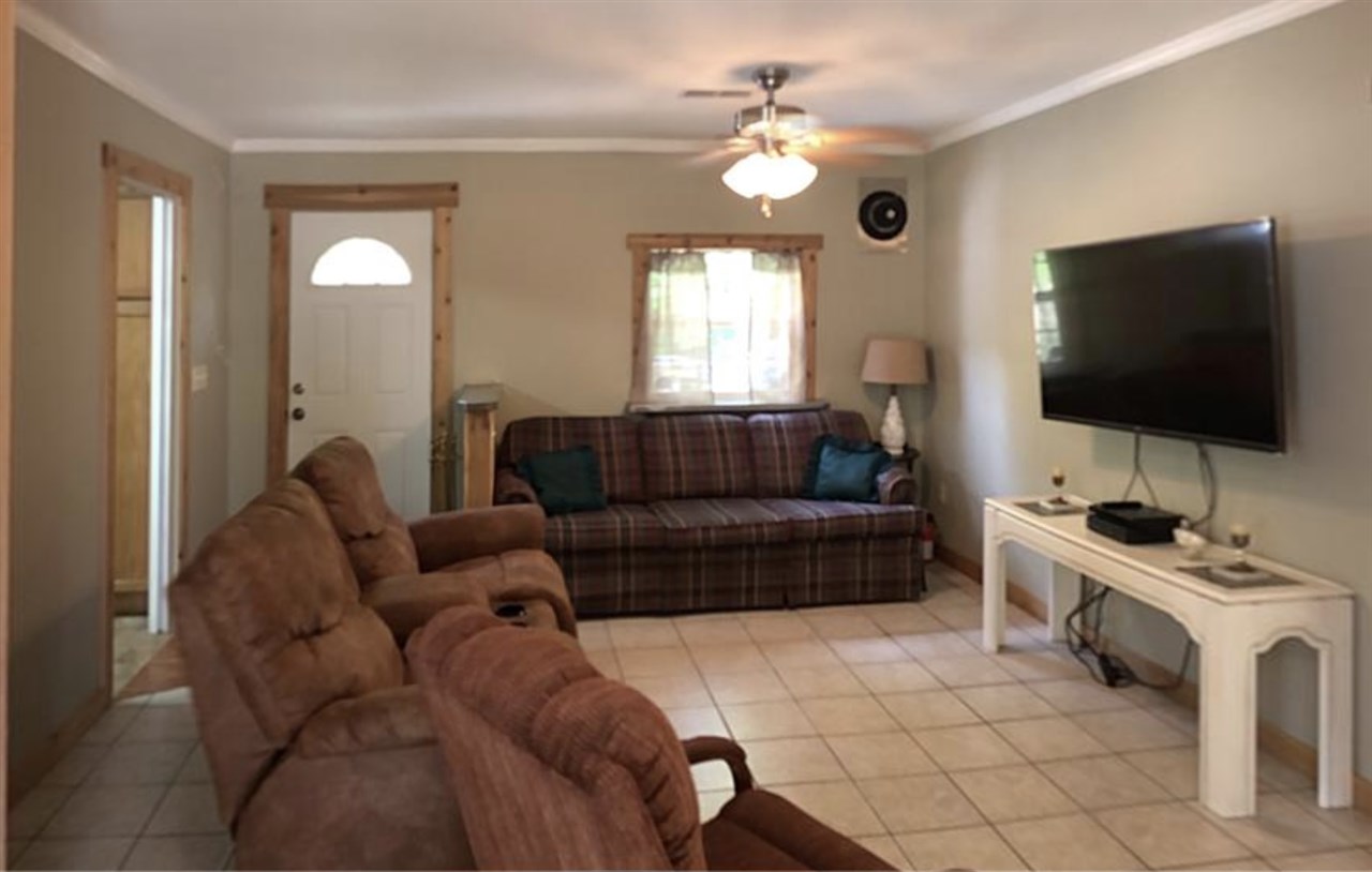 4192 Morrison Creek Road Clifton, TN 38425 - Photo 7 of 25 In Dining area facing Living Room and patio entrance. Set up for wood burning stove that has been moved to storage.