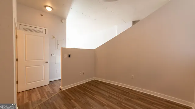 a bathroom with a granite countertop bathtub shower and toilet