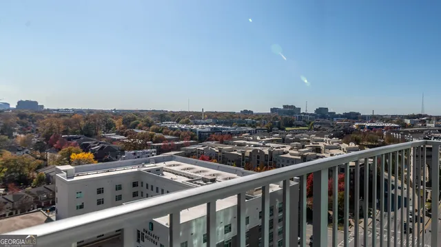a view of swimming pool with outdoor seating and city view