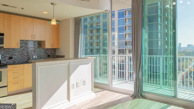 a view of a kitchen from the hallway
