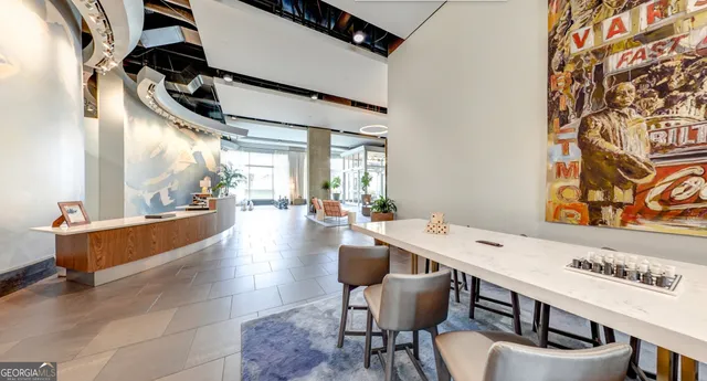 a view of a living room and kitchen