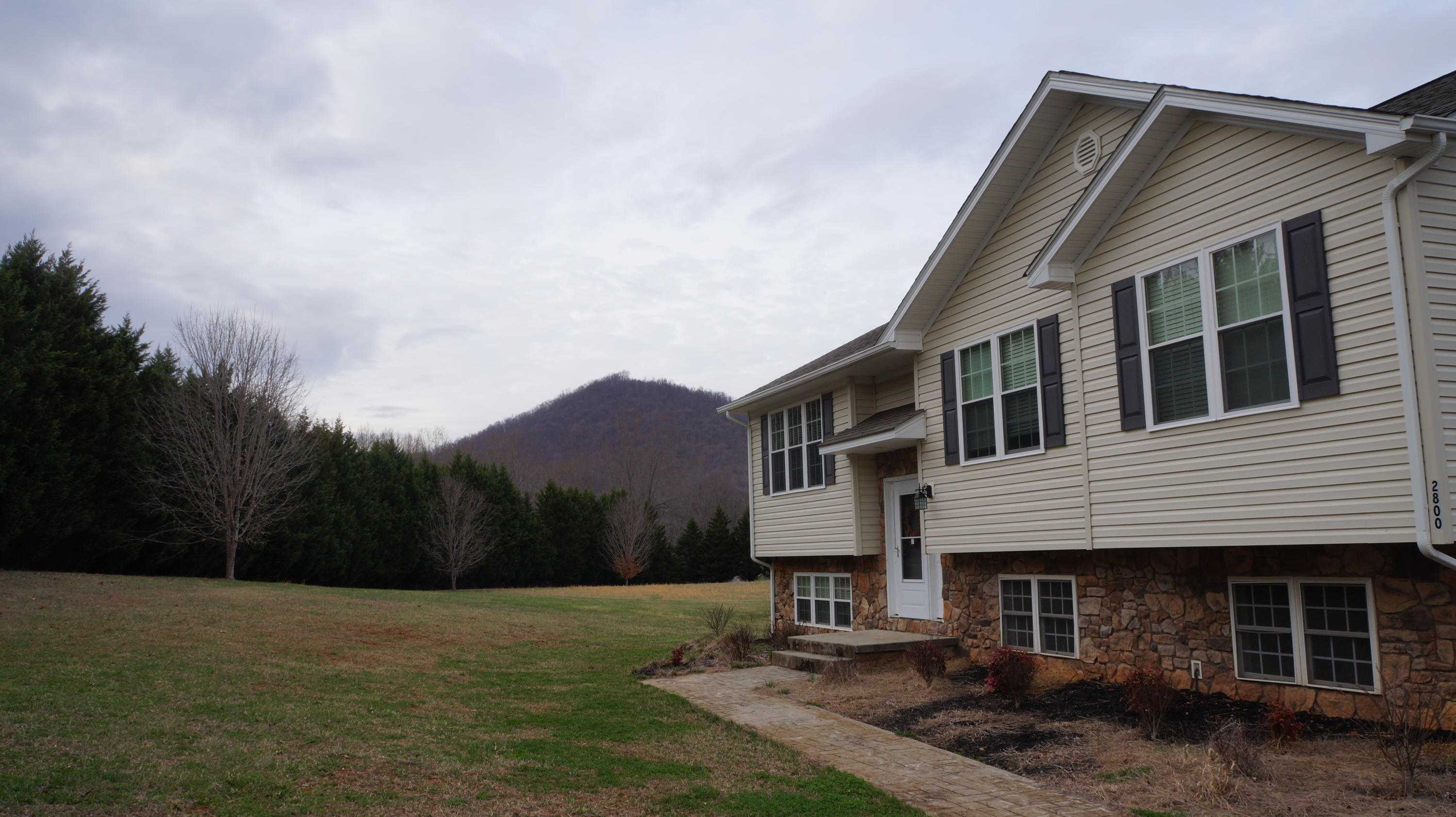 2800 Nemmo Road Vinton, VA 24179 - Photo 4 of 11 a front view of a house with a yard and garage