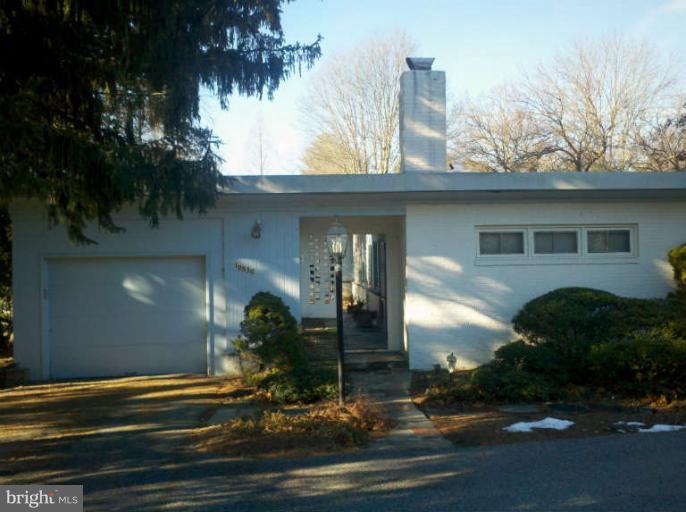 a front view of a house with yard