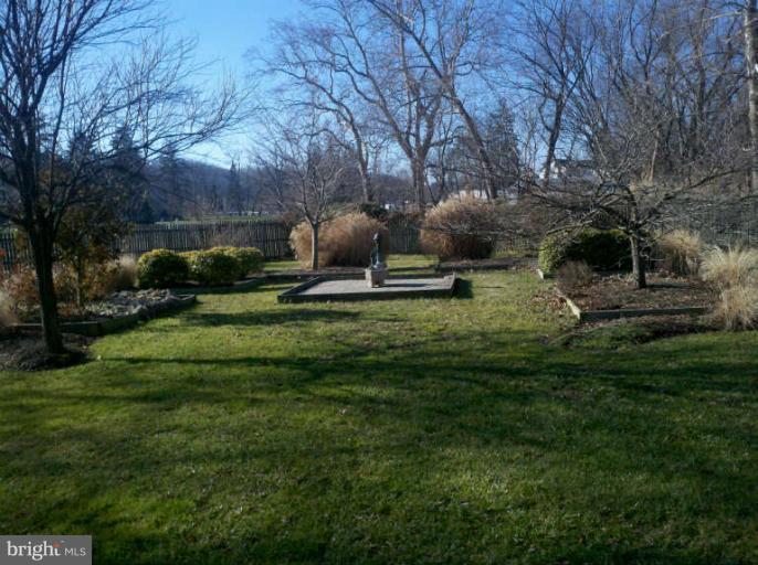10530 Stevenson Road Stevenson, MD 21153 - Photo 12 of 29 a backyard of a house with lots of green space and plants
