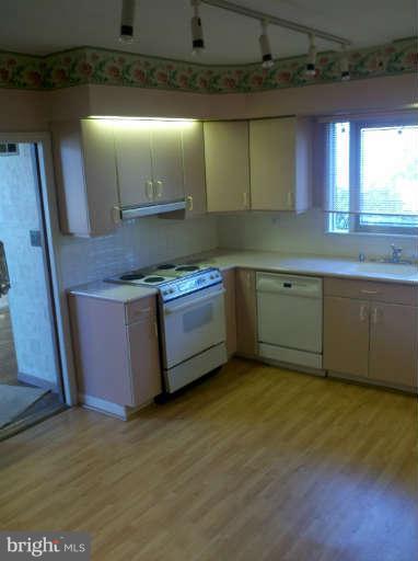 10530 Stevenson Road Stevenson, MD 21153 - Photo 20 of 29 a kitchen with stainless steel appliances granite countertop a sink and a stove