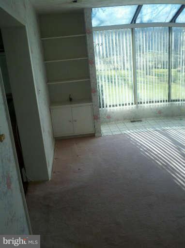 10530 Stevenson Road Stevenson, MD 21153 - Photo 27 of 29 a view of a room with wooden floor and windows