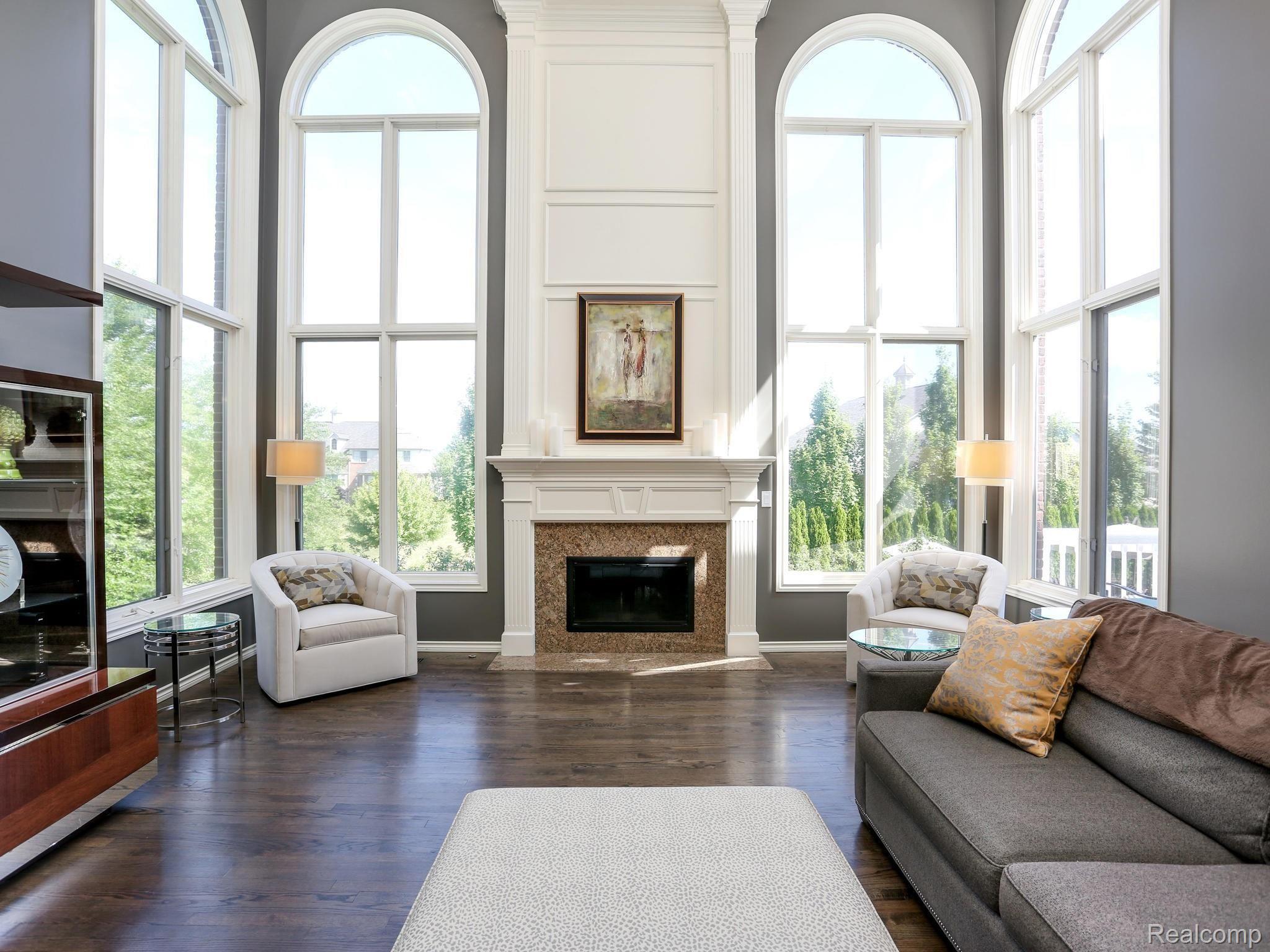 5323 Carlisle Court Rochester, MI 48306 - Photo 15 of 57 Gas fireplace with soaring windows.