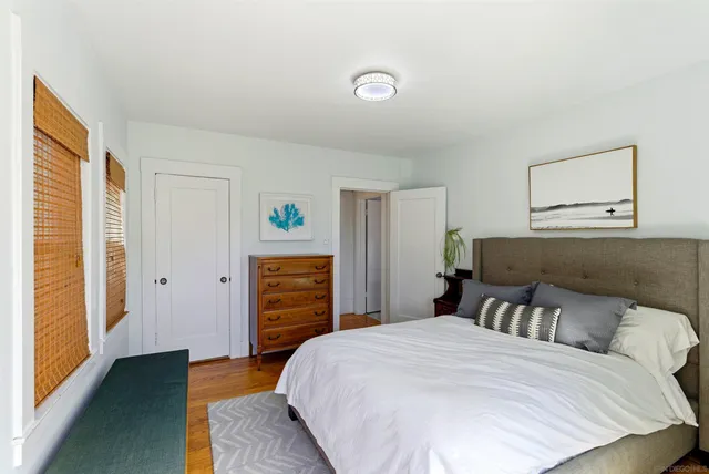 a bedroom with a bed and a dresser