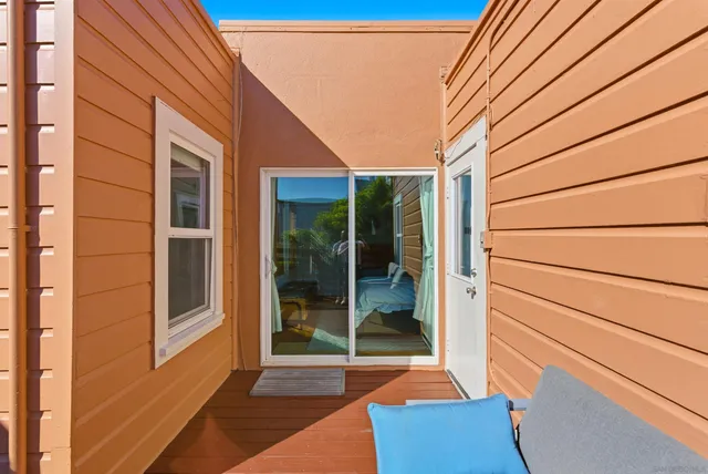 a view of balcony with furniture
