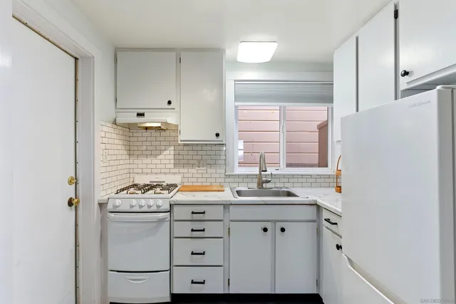 a living room with furniture a rug and a window