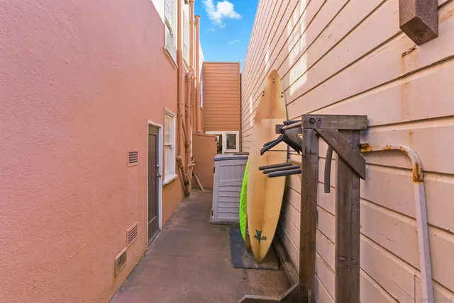 a front view of a residential apartment building with a yard