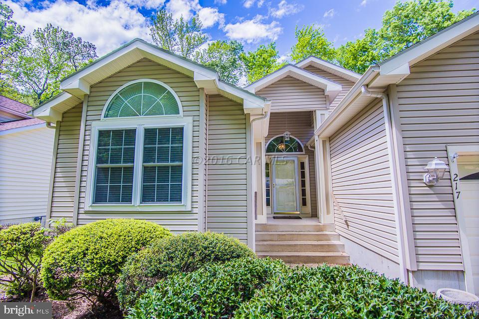 217 Windjammer Road Ocean Pines, MD 21811 - Photo 16 of 47 a front view of a house with a yard