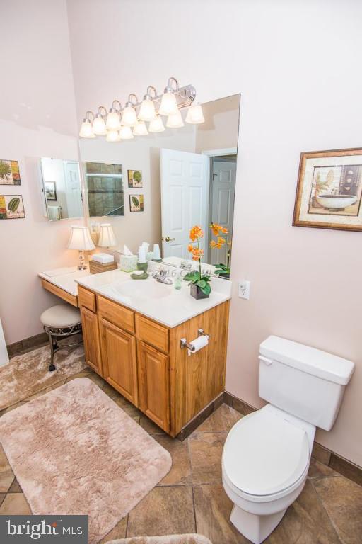 217 Windjammer Road Ocean Pines, MD 21811 - Photo 20 of 47 a spacious bathroom with a toilet sink and mirror