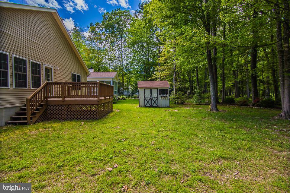 217 Windjammer Road Ocean Pines, MD 21811 - Photo 3 of 47 a view of a house with backyard and sitting area