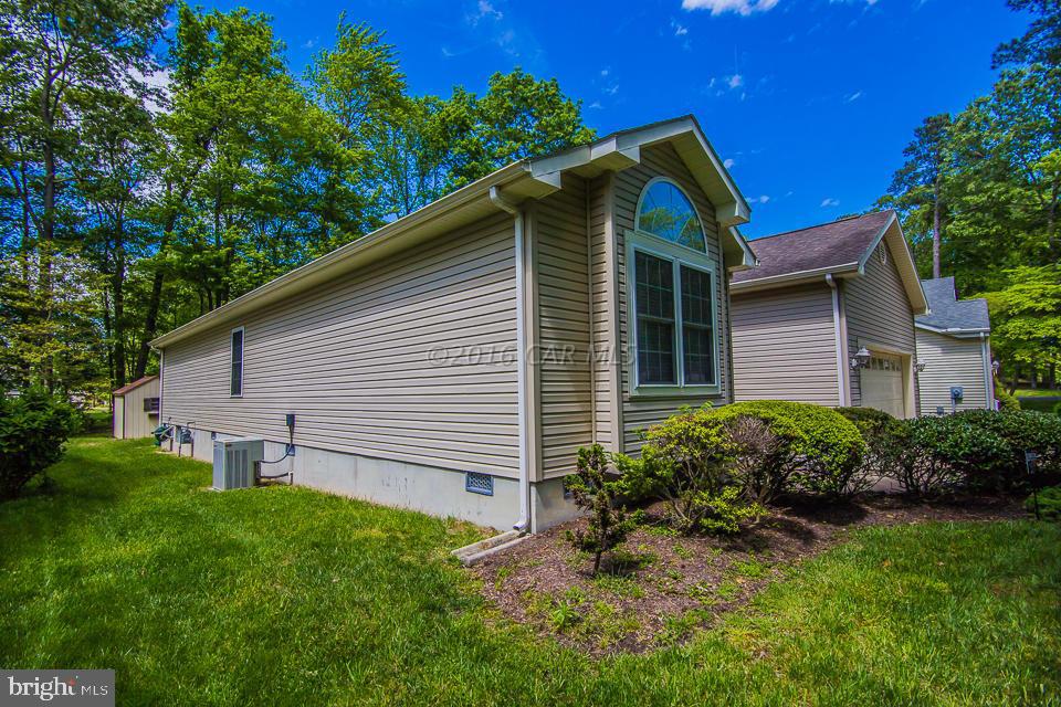 217 Windjammer Road Ocean Pines, MD 21811 - Photo 22 of 47 a front view of a house with garden